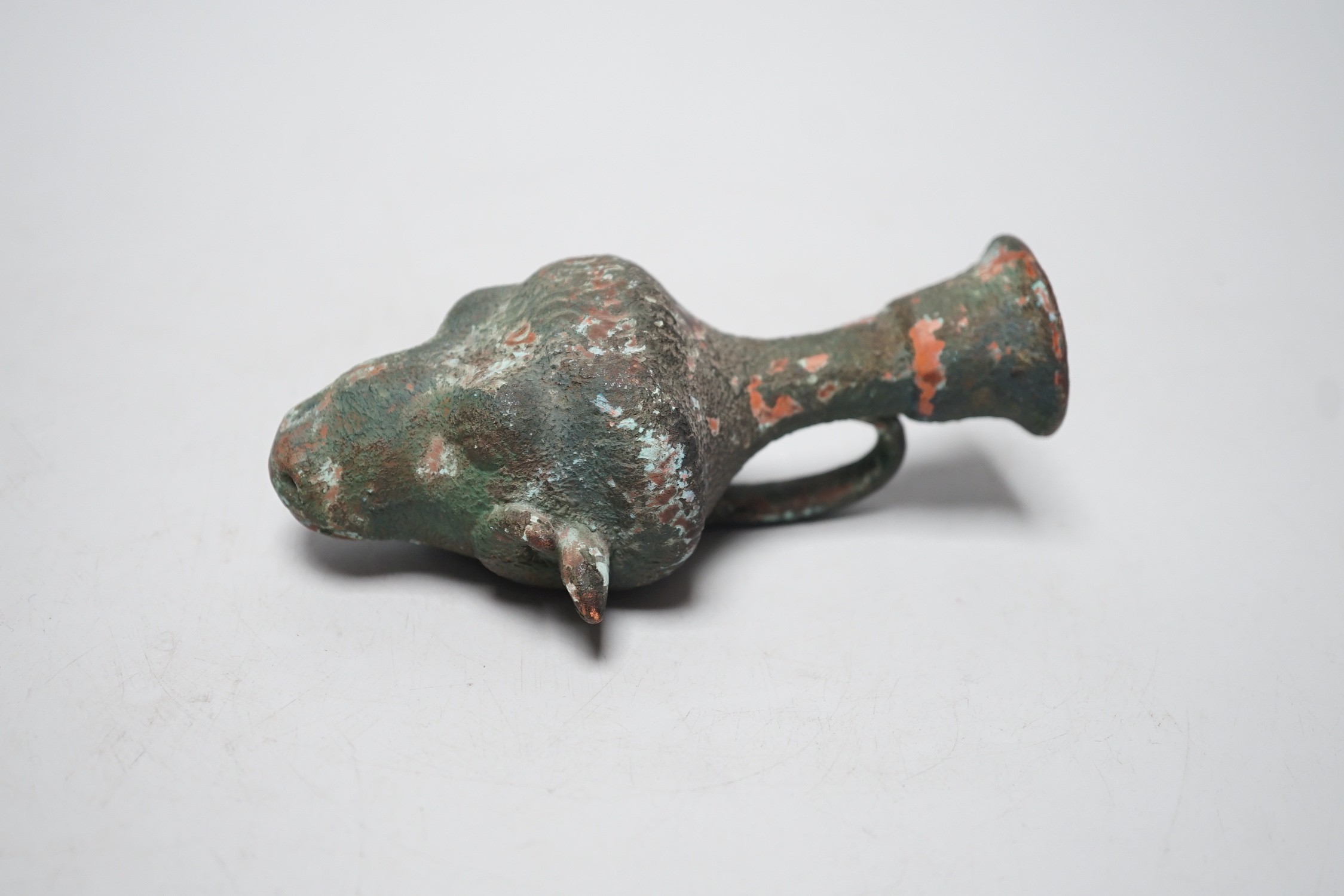 Grand Tour souvenir, a green painted terracotta ram's head Rhyton after the Antique, 13cm